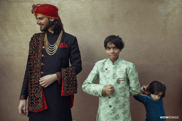 Groom posing with Children of family at a traditional Muslim Wedding in Delhi