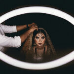 Bride getting her hair and make-up done at a Muslim Wedding in Delhi