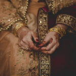 Muslim Bride wearing beautiful wedding dress and mehndi at her wedding