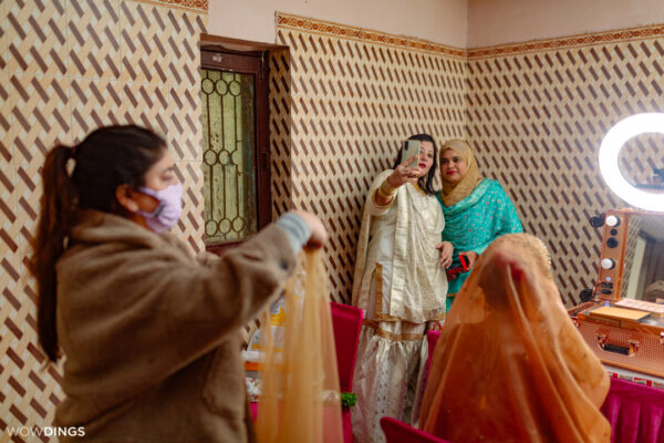 Friends and relatives taking selfie at an intimate muslim wedding in delhi
