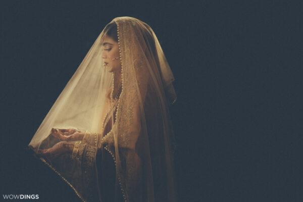 Beautiful veiled Muslim bride in sunlight bridal portrait at a muslim wedding in delhi by wowdings
