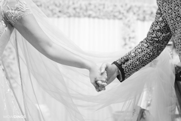 Sarah Hashmi holding hands with husband at her wedding nikaah