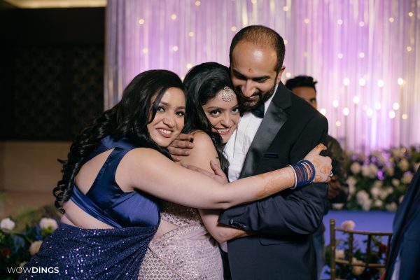 Intimate family photograph on sangeet ceremony at an indian wedding in delhi on engagement day candid photography