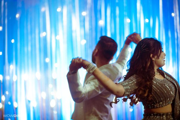people dancing at a delhi wedding sangeet ceremony candid photography Superman got hitched