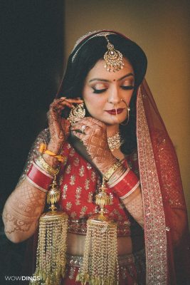 Beautiful bridal portrait of bride wearing earrings candid wedding photography