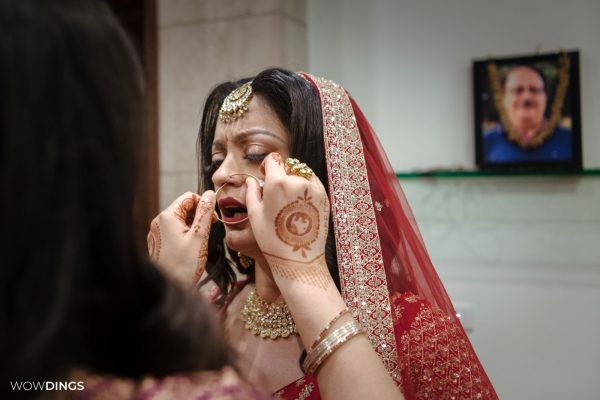 bride wearing nose ring in n indian wedding candid photography