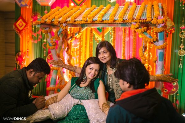 Mehndi Ceremony of Delhi bride candid wedding photography with mother