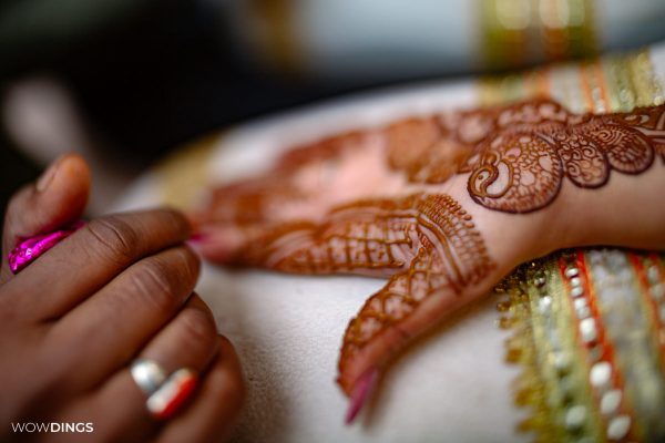 Mehndi Ceremony of Delhi bride candid wedding photography close-up of hand