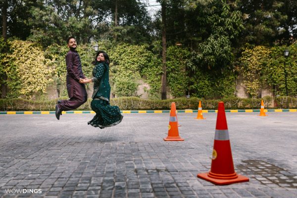 fun couple portrait at delhi wedding mehndi ceremony people dancing at Mehndi Ceremony of Delhi bride candid wedding photography