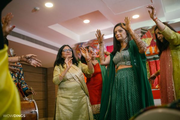 bride dancing at Mehndi and sangeet Ceremony of Delhi bride candid wedding photography