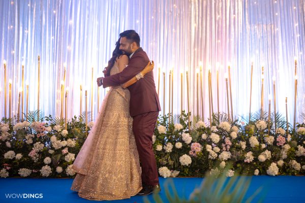 bride and groom hugging after exchanging rings on engagement ceremony in an indian wedding in delhi candid wedding photography