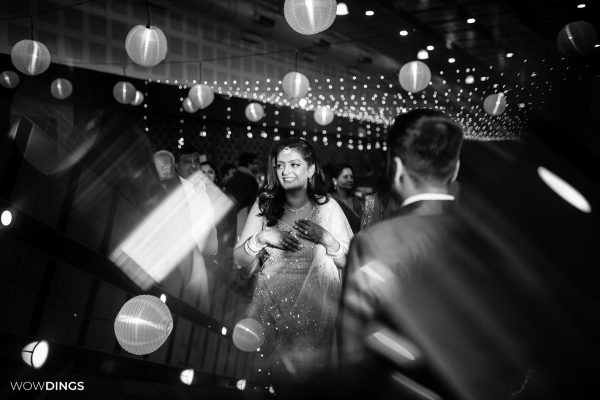 casual moment of bride at a delhi wedding sangeet ceremony candid photography