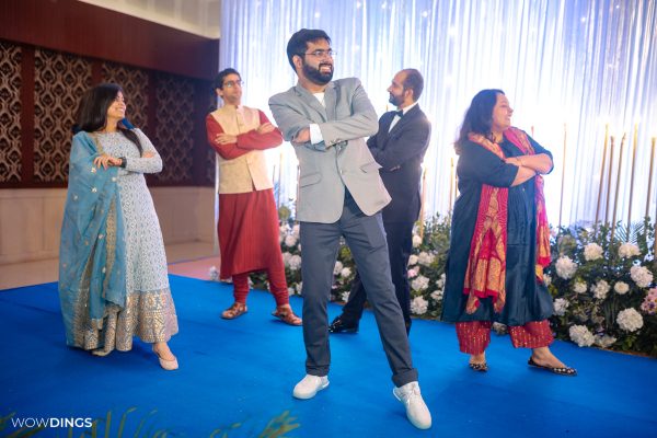 people dancing on sangeet ceremony at an indian wedding in delhi on engagement day candid photography