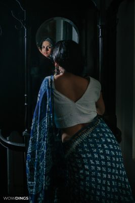 bengali girl wearing sari in-front of mirror
