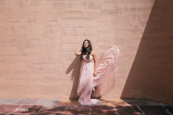 pre wedding photography against pink textured wall