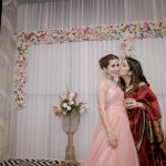 Actress Sarah Hashmi being kissed by her friend at her Wedding Reception