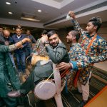 groom sitting on dhol on mehndi ceremony in delhi Superman got hitched candid photography