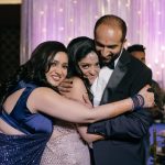 Intimate family photograph on sangeet ceremony at an indian wedding in delhi on engagement day candid photography