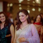 casual bridal portrait of a beautiful bride as she enters her engagement ceremony at an indian wedding candid photography in delhi