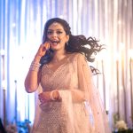 beautiful bride dancing on sangeet ceremony at an indian wedding in delhi on engagement day candid photography