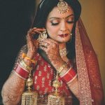 Beautiful bridal portrait of bride wearing earrings candid wedding photography