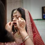 bride wearing nose ring in n indian wedding candid photography
