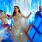 bride dancing on stage at a delhi wedding sangeet ceremony candid photography