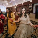 bride caught off-guard and dancing at a delhi wedding sangeet ceremony candid photography