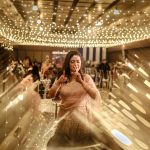 Creative portrait of a beautiful bride dancing on her sangeet ceremony night in Delhi candid wedding photography