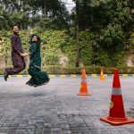 fun couple portrait at delhi wedding mehndi ceremony people dancing at Mehndi Ceremony of Delhi bride candid wedding photography