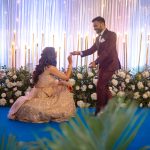 bride went down on her knees to propose groom on engagement ceremony in an indian wedding in delhi candid wedding photography