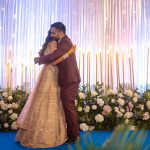 bride and groom hugging after exchanging rings on engagement ceremony in an indian wedding in delhi candid wedding photography