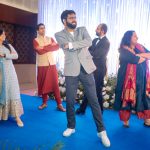 people dancing on sangeet ceremony at an indian wedding in delhi on engagement day candid photography
