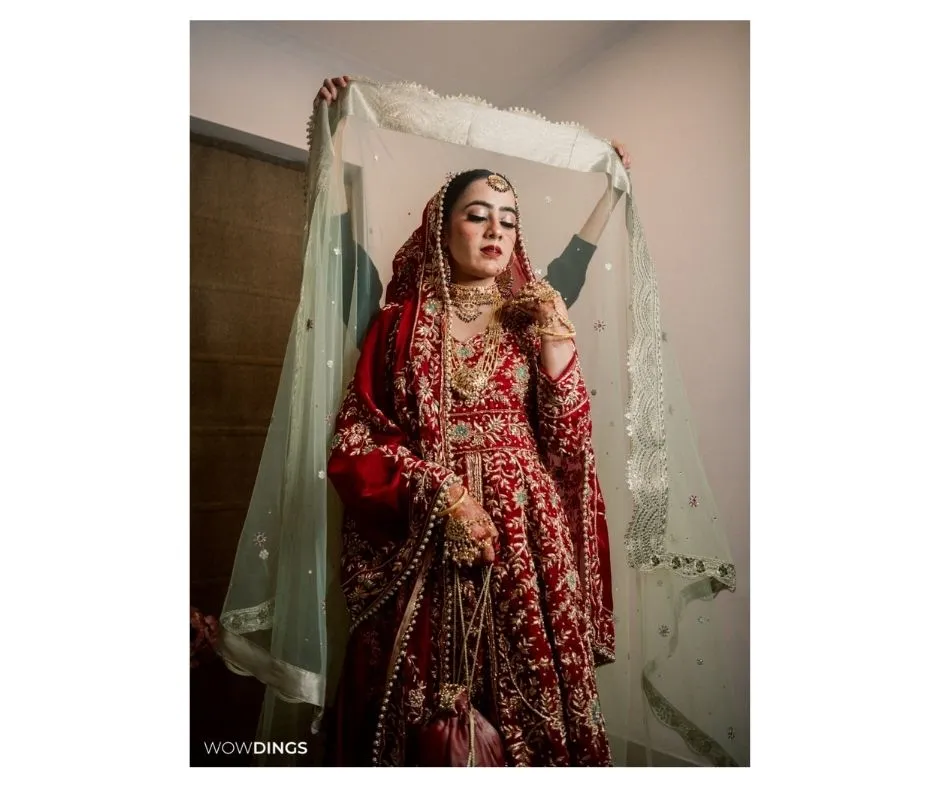 Nikaah: a muslim wedding photography blog 9 A Muslim bride gracefully putting on her bridal veil.